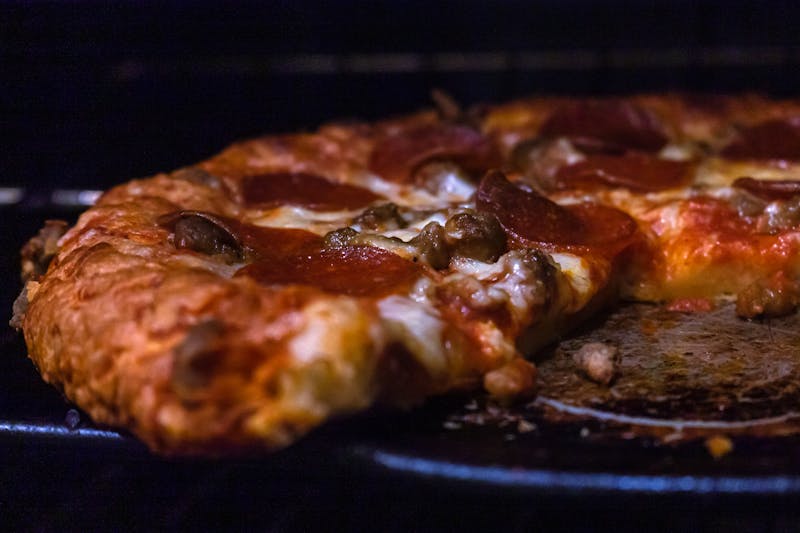 Fresh pizza ingredients being prepared
